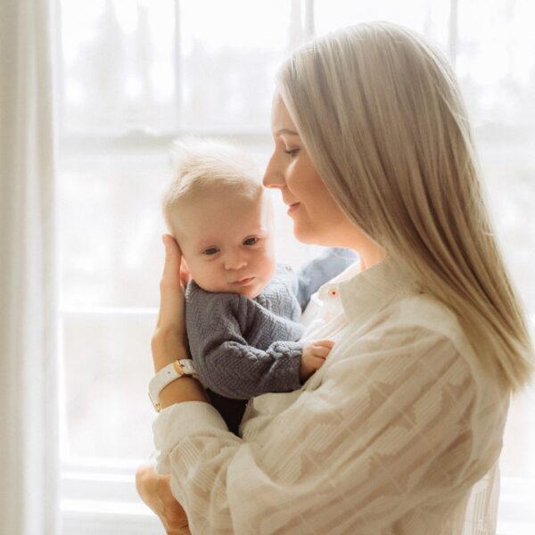 A mom holding her baby.