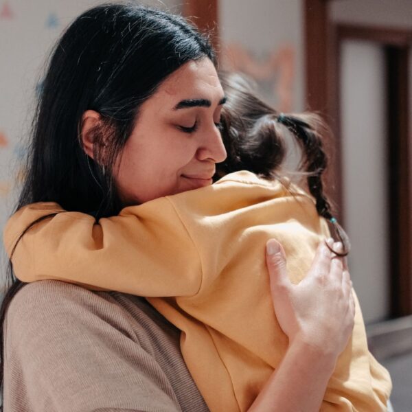 A woman holding her child.