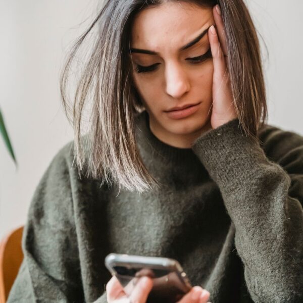 stressed woman after talking on the phone