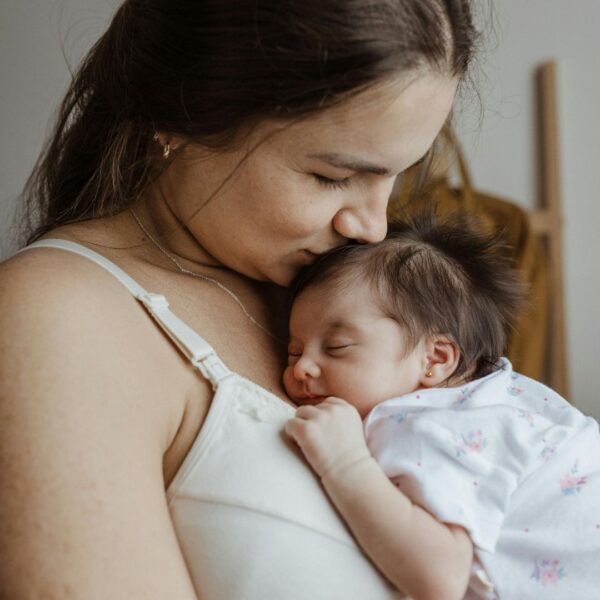 woman holding her newborn